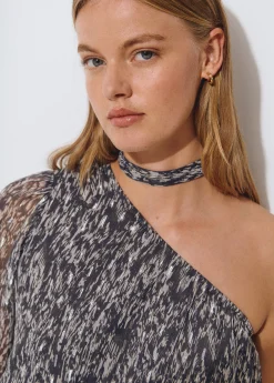 Blusa asimétrica brillo estampada