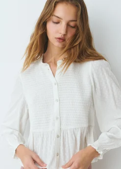Blusa smock con botones plumeti