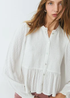 Blusa smock con botones plumeti