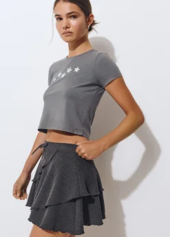 Falda corta volantes tejido estructura