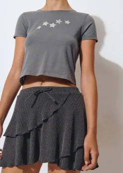 Falda corta volantes tejido estructura