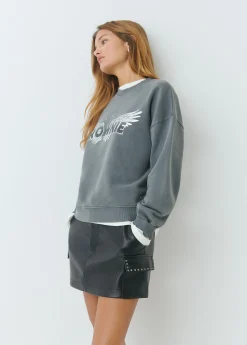 Falda mini efecto piel tachas