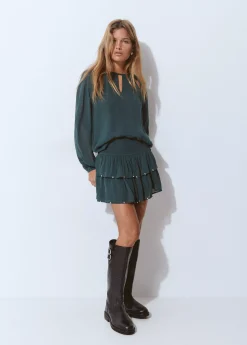 Falda volantes detalle tachas