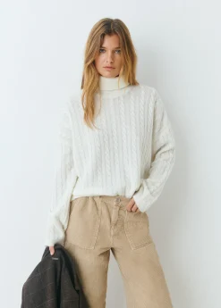 Jersey cuello alto trenzas