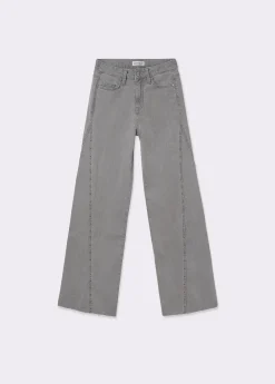 Pantalón corte lateral tachas