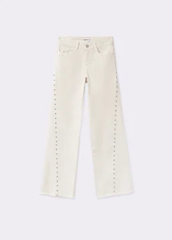 Pantalón corte lateral tachas