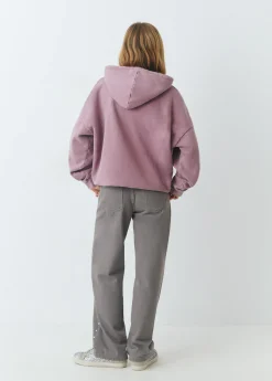 Pantalón tachas laterales